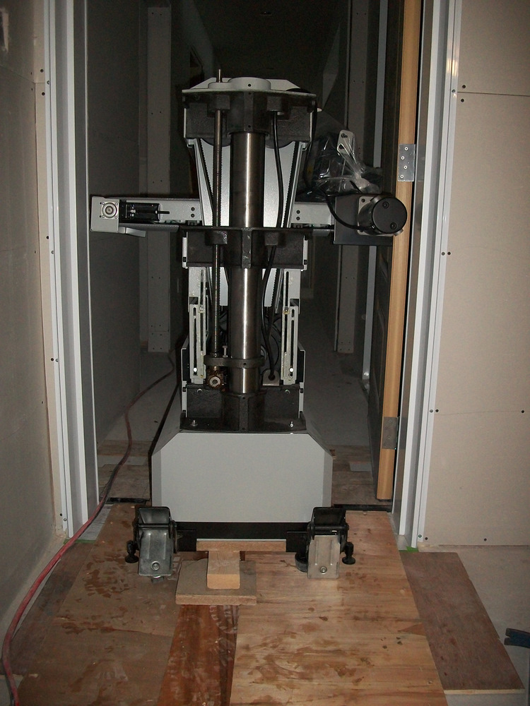 Dual drum sander rolling down the hallway and over the doorsill.