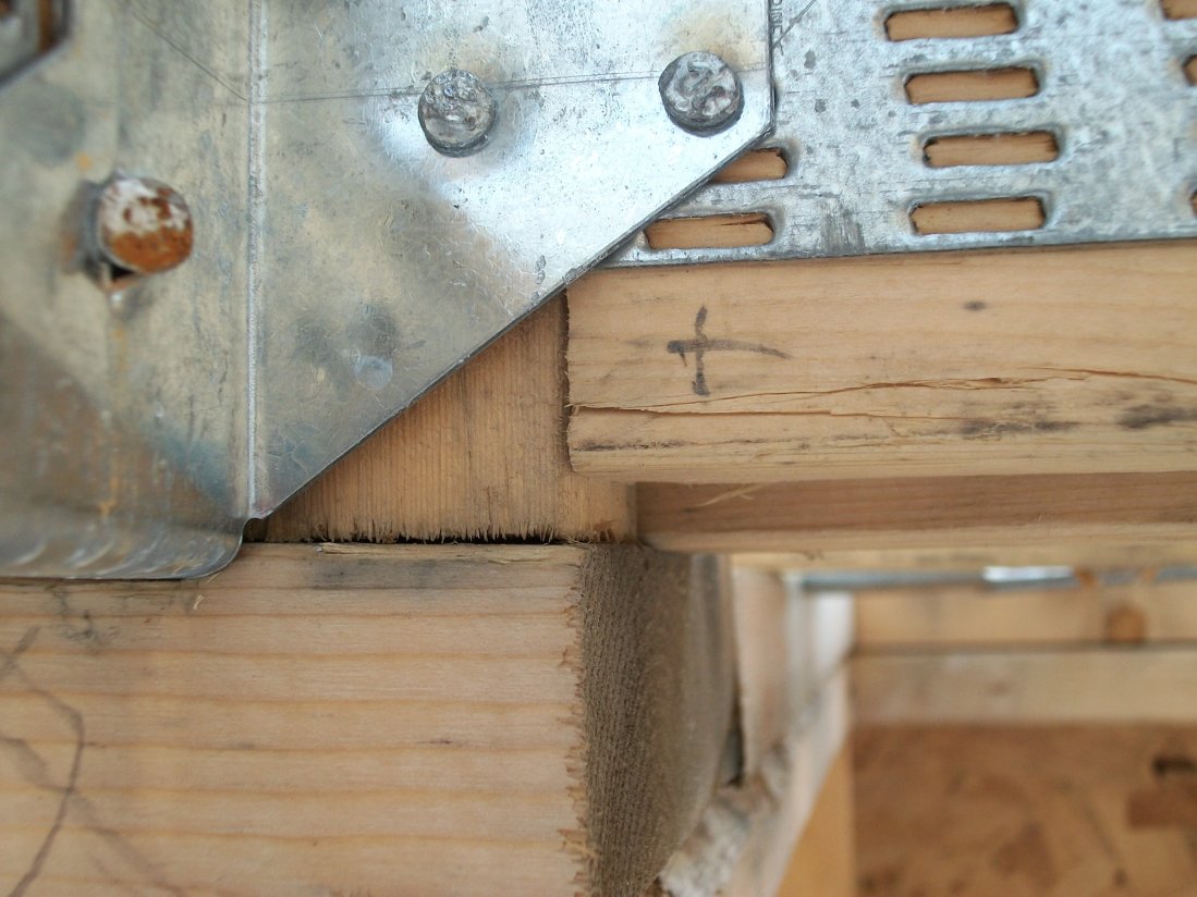 Closeup of one misplaced Gang-Nail plate, by 5/16"! Yes, engineering will likely state that; "It will hold." but will it?