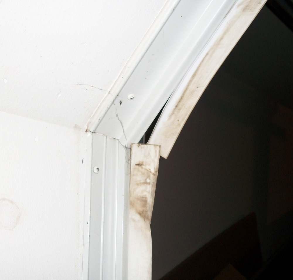 Improper method. Notice the torn weatherstripping.