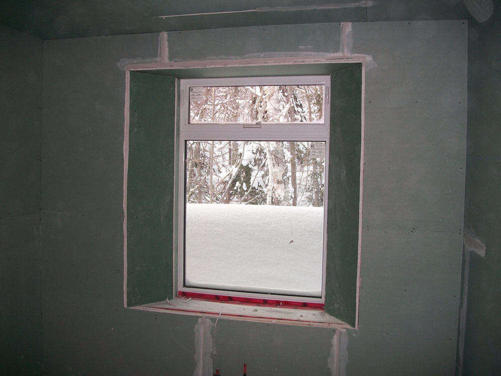 Typical splayed window well, cut out for bond.