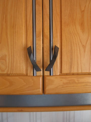 kitchen door detail~book matched rails and stiles~1-1/2 weeks to hand sculpt & polish 56 Macassar ebony handles