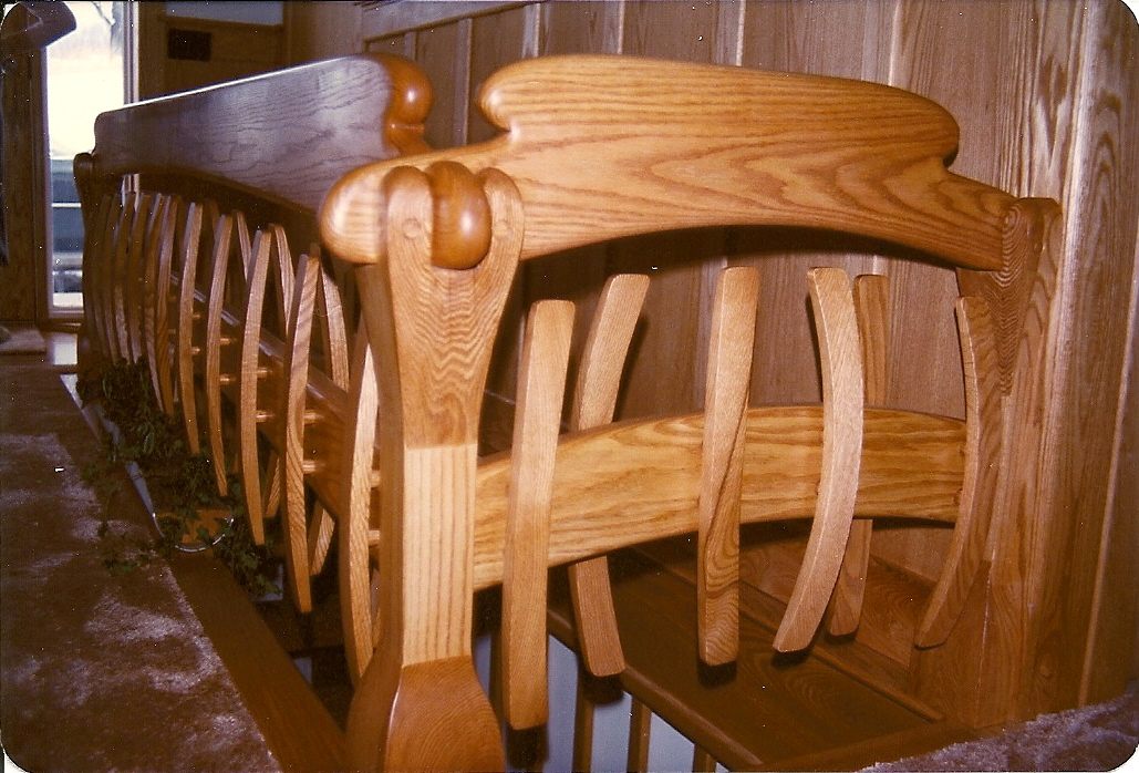 basement hand rail of solid red oak in whale ribcage motif
