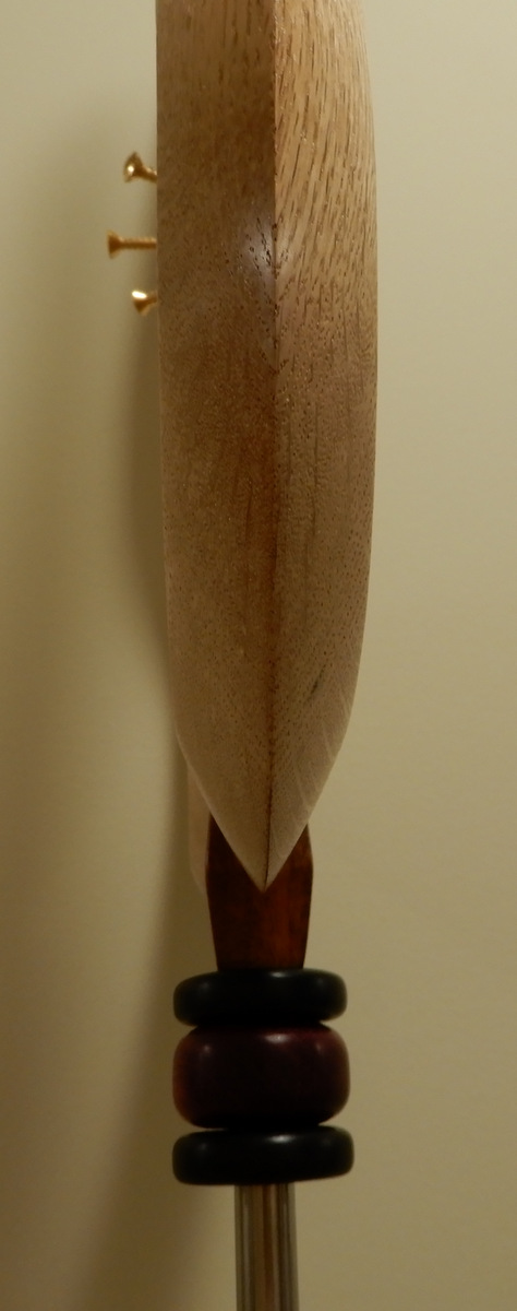 Edge on, carved both sides.